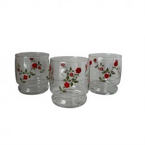 Set of three Anchor Hocking glass short tumblers with red rose pattern.